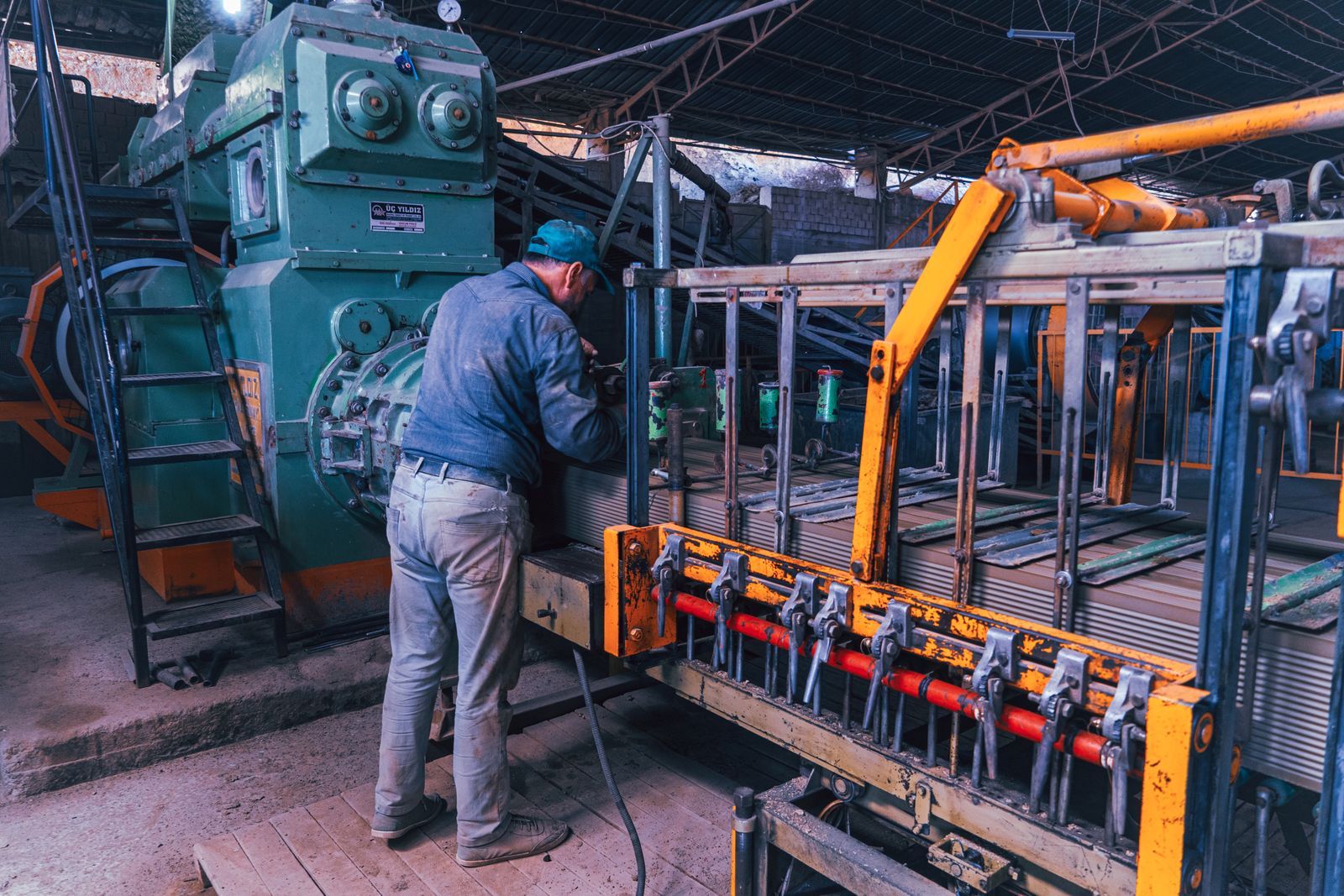 Worker operating industrial machinery